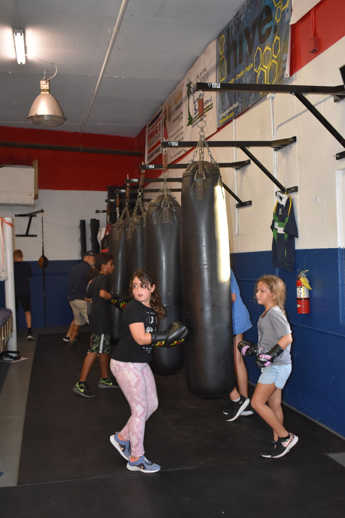 Kids Living Their Best 4. Hitting the bags after the relay..JPG